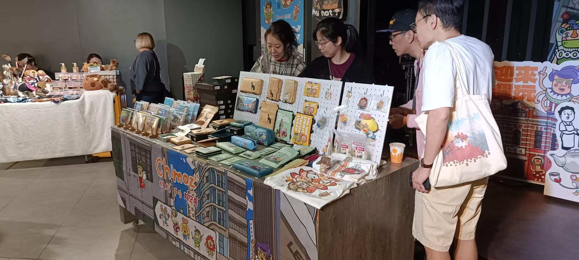 Visitors exploring the Chimoz market stand at D2 Place